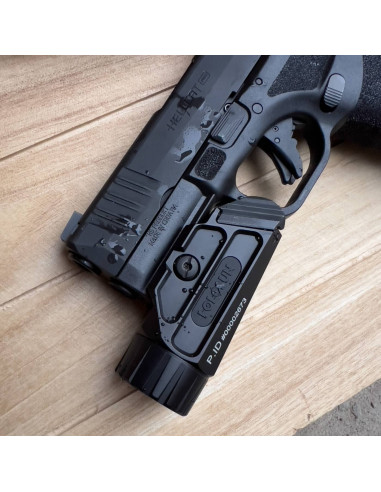 Holosun P.ID 1000 lumen tactical rechargeable weapon flashlight mounted on a pistol